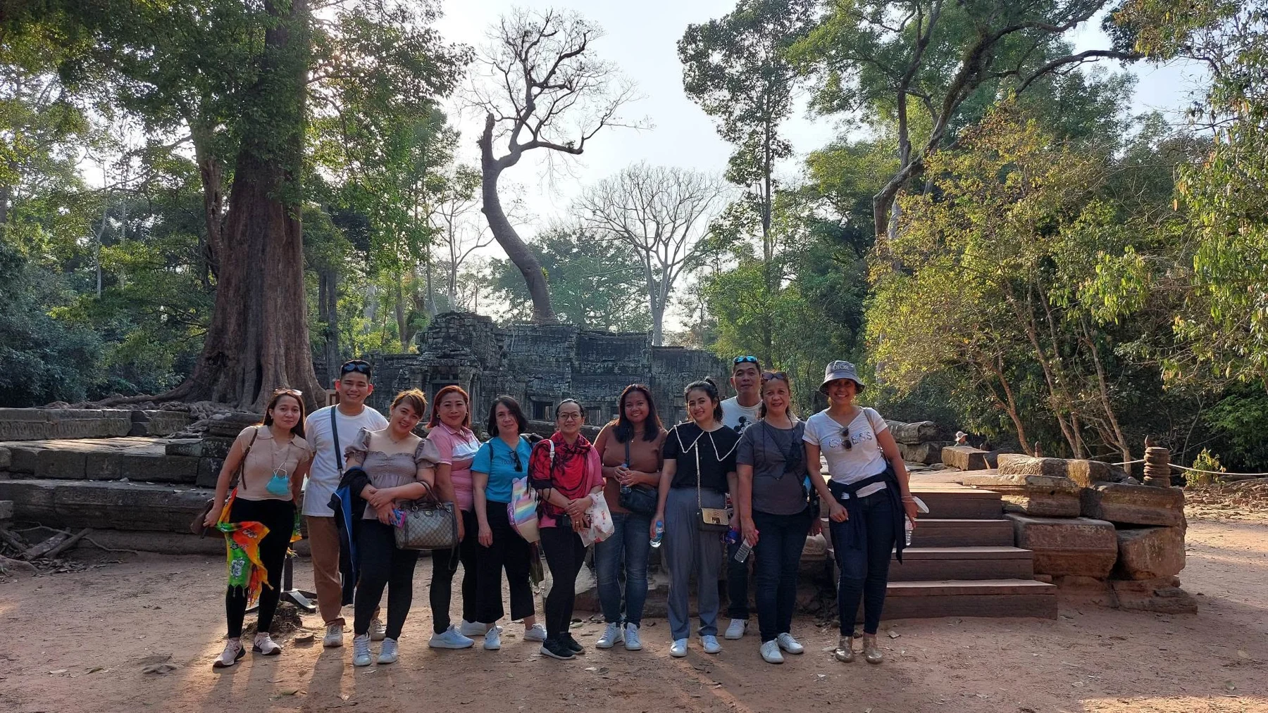 Travel group exploring historic temple grounds